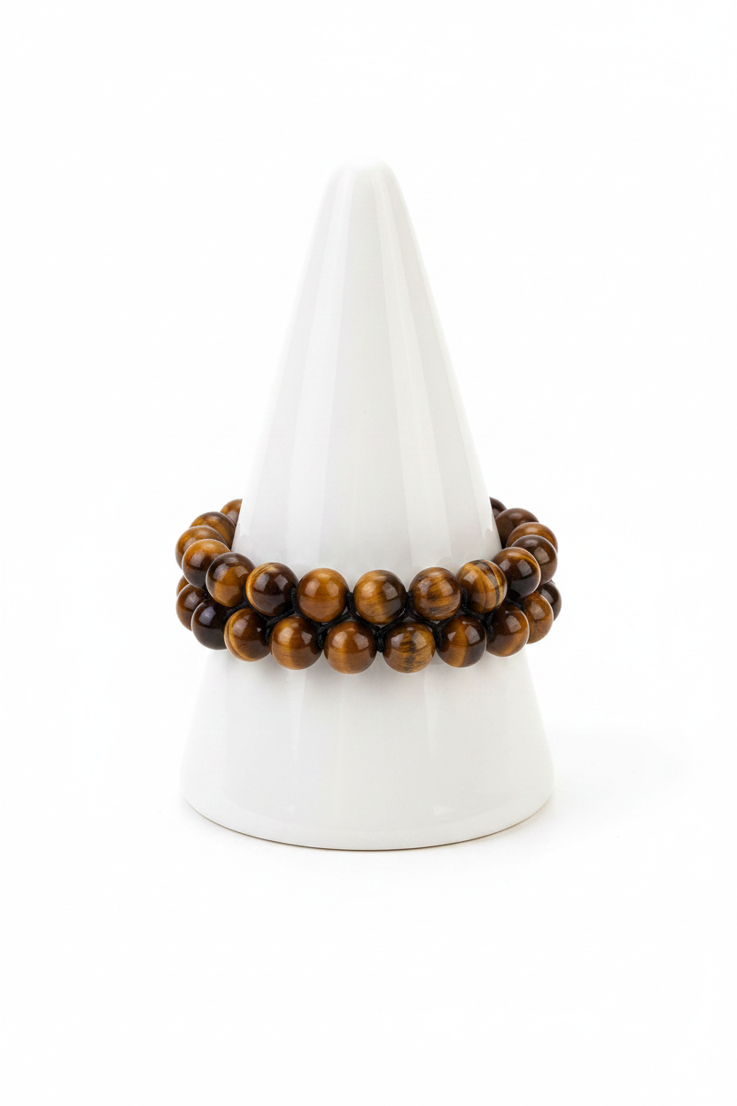 Tiger eye double strand bracelet on white porcelain cone stand