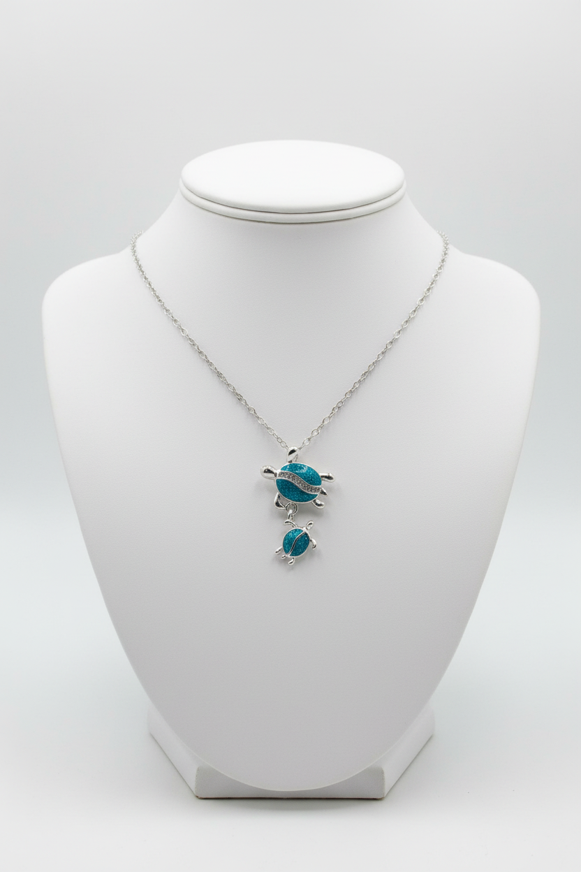 Turtle necklace cable chain on white porcelain bust stand - corrected orientation