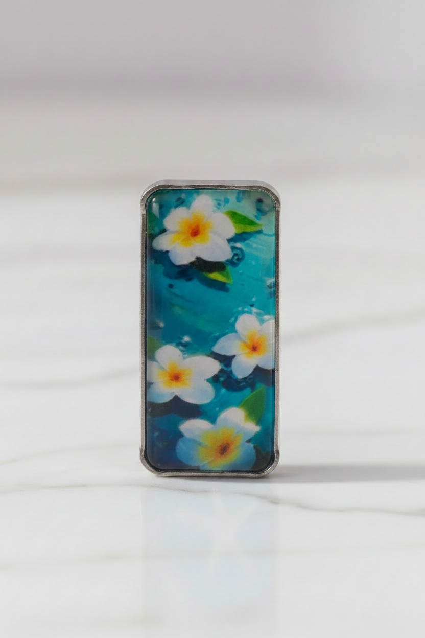 Extreme close-up of aqua floral earring
