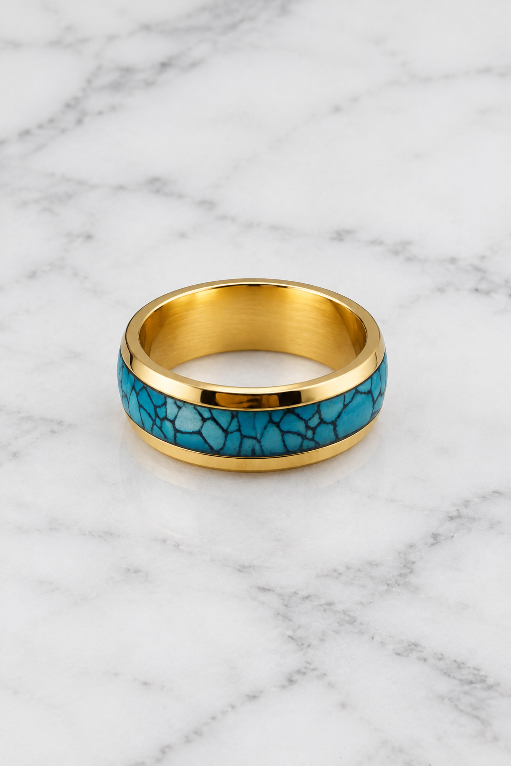 Gold turquoise inlay ring flat lay on white marble