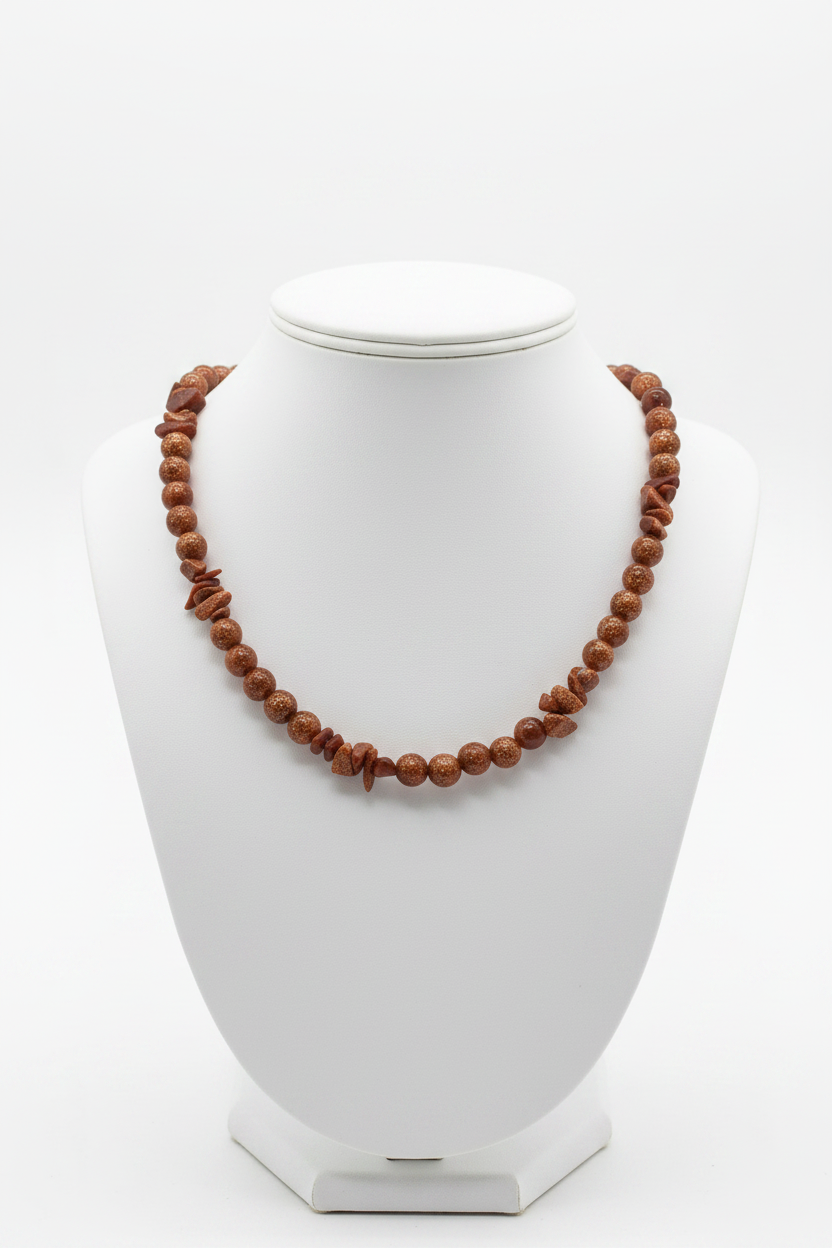 Goldstone necklace on white ceramic bust stand