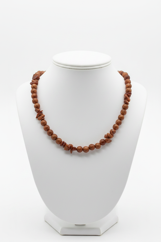 Goldstone necklace on white ceramic bust stand