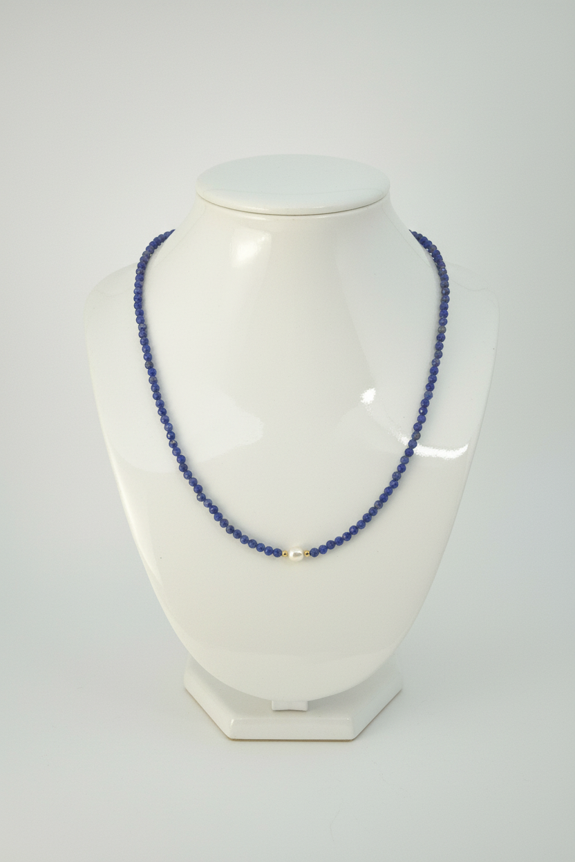 Lapis lazuli necklace full view on white porcelain bust stand