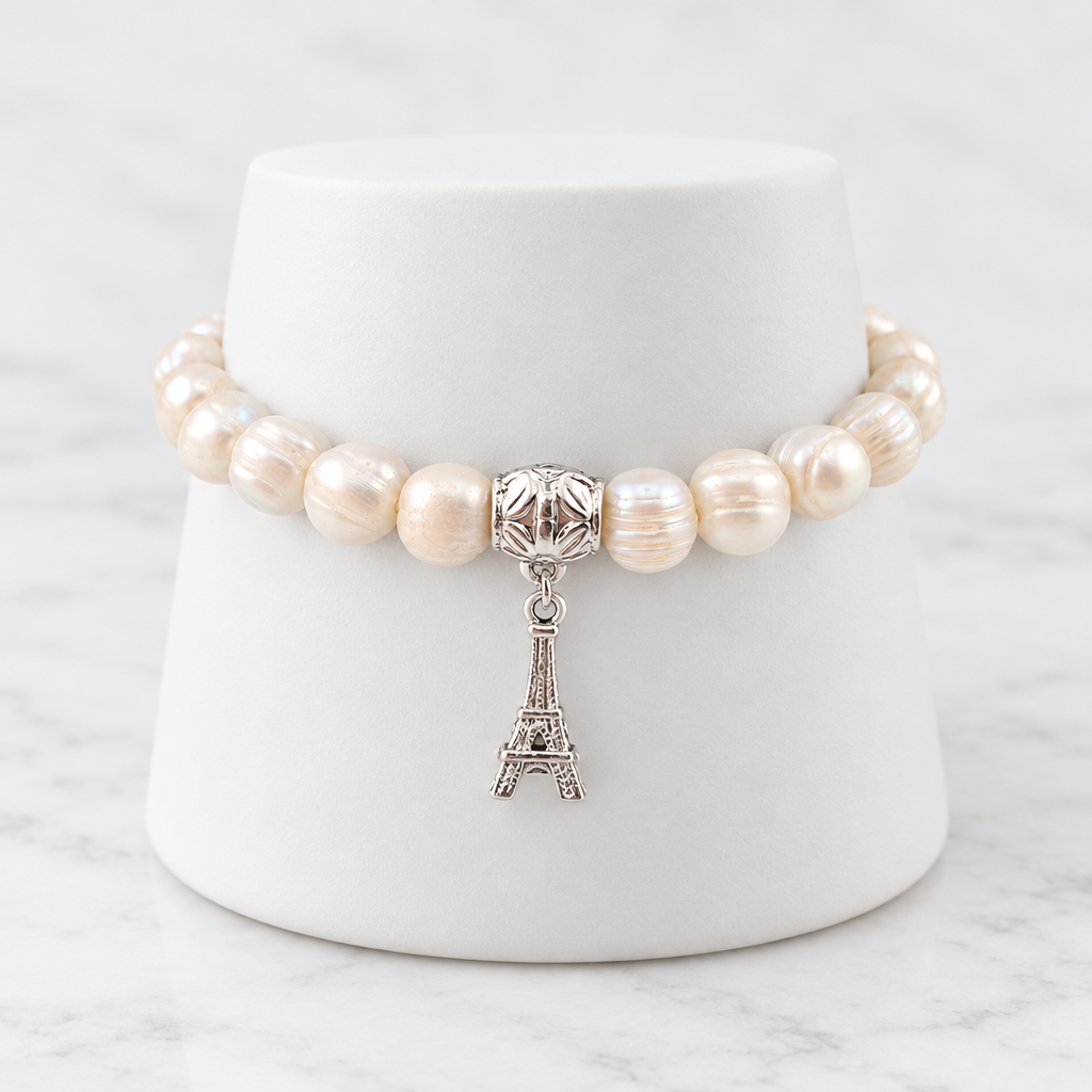 LDJ-1258 freshwater pearl bracelet with Eiffel Tower charm on white porcelain and marble