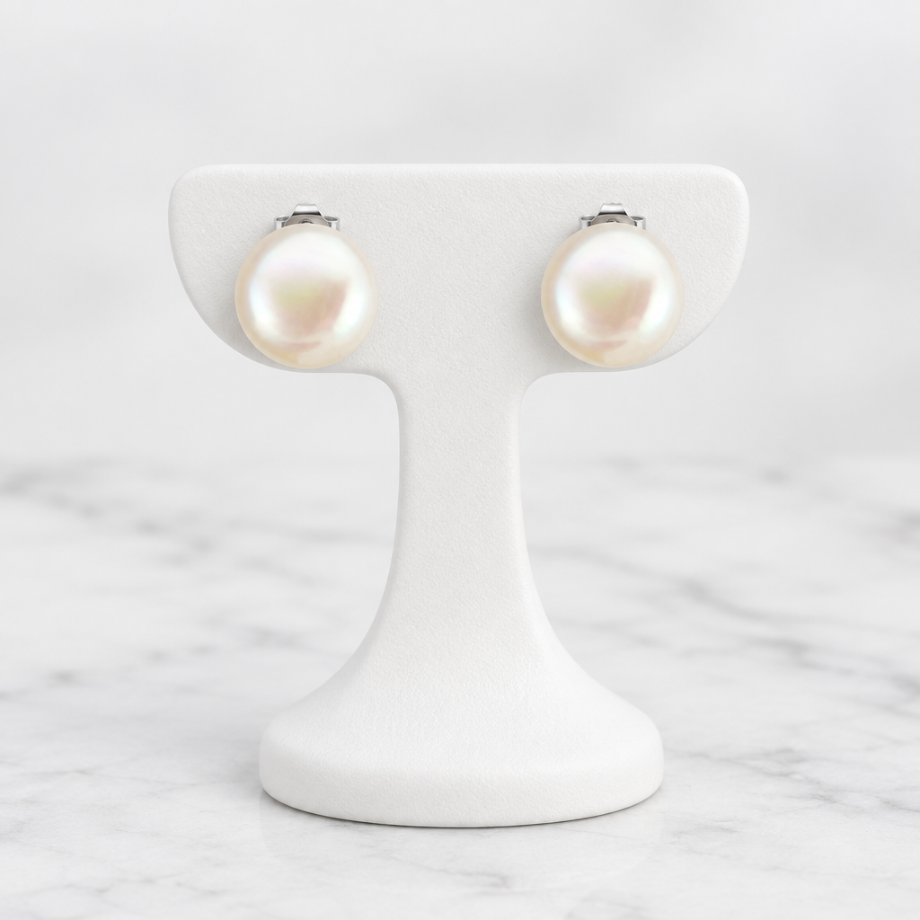 LDJ-1521 large freshwater pearl stud earrings on a white porcelain display and marble background