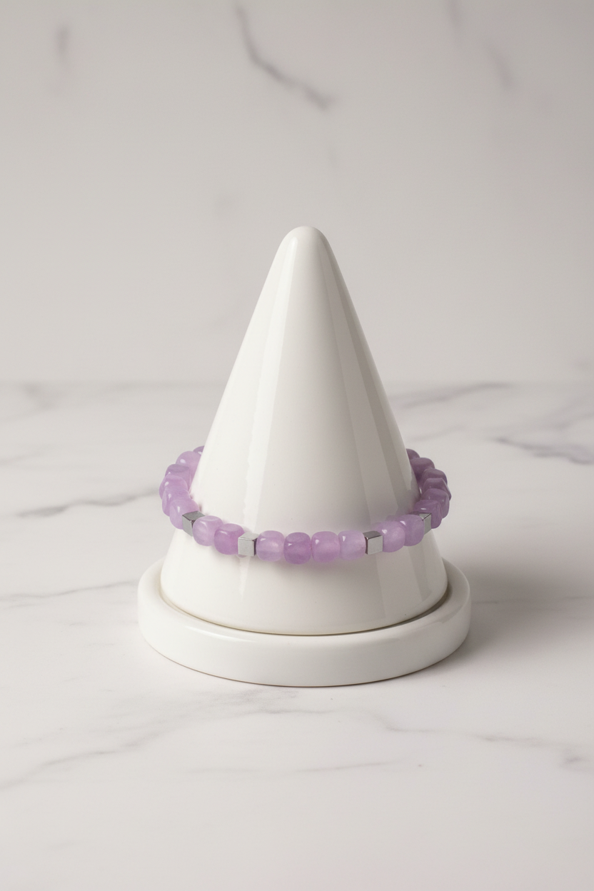 Lilac irregular bead bracelet on white porcelain cone