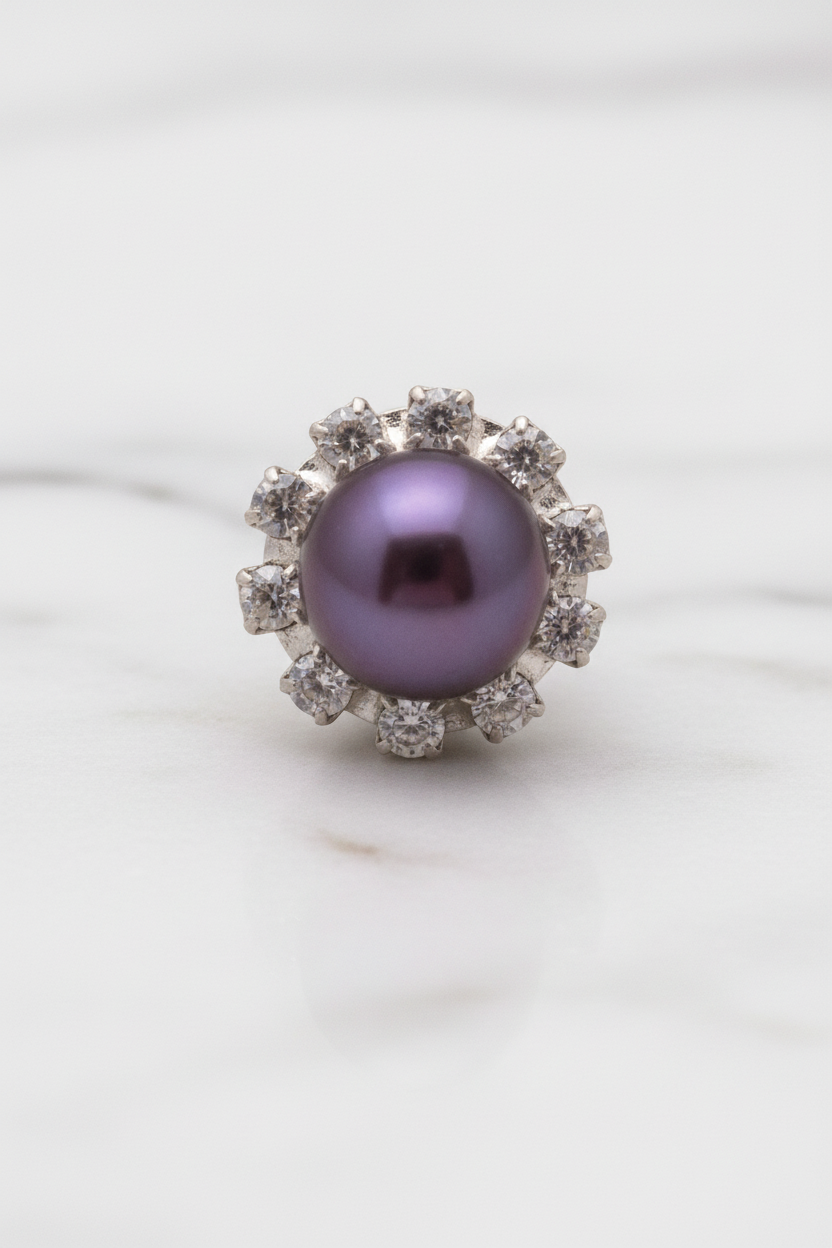 Macro of purple pearl floral cluster stud