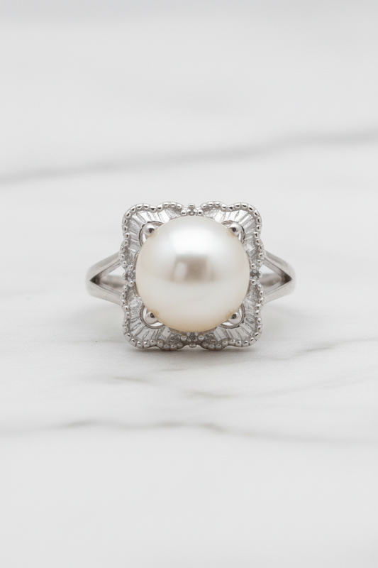 Pearl cocktail ring on white porcelain stand