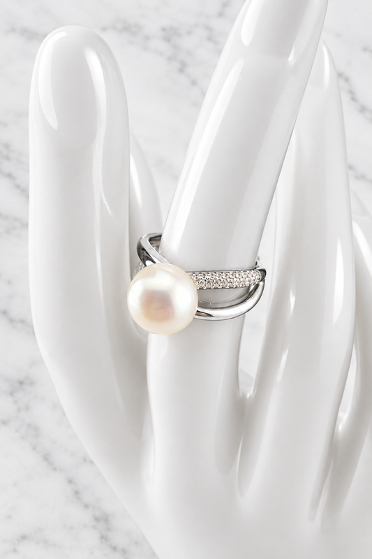 Pearl ring 1534 on a white porcelain display