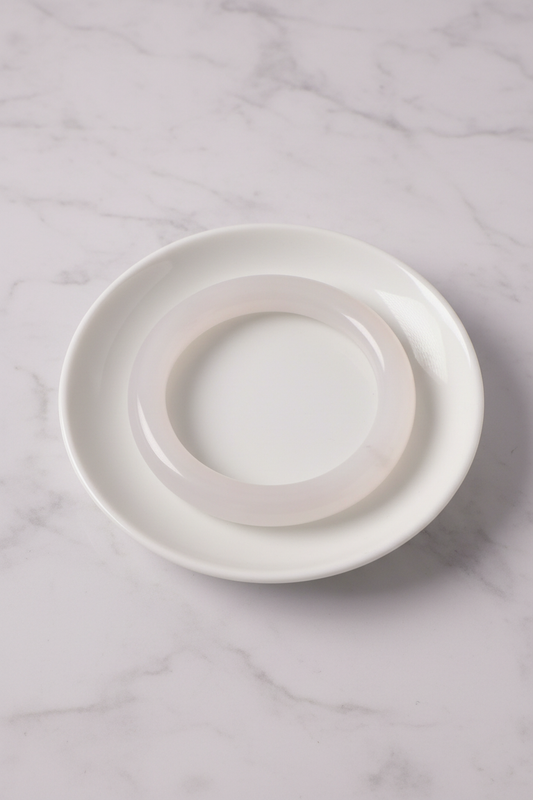 Translucent white bangle flat lay